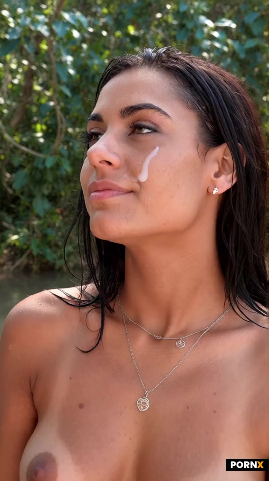Gorgeous 18 year old tan Latina beside sunny jungle river